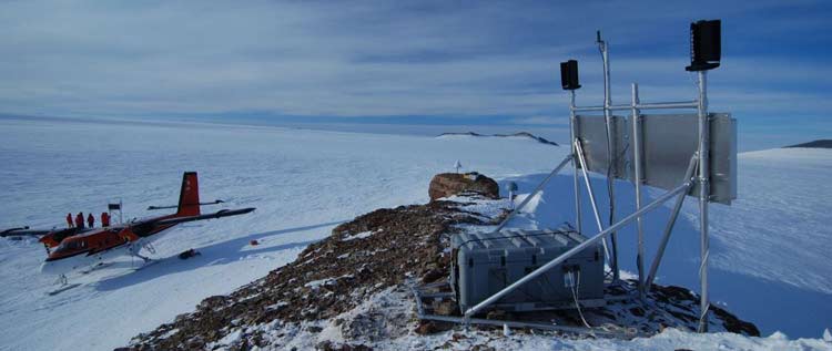 GPS station overlooking snowy landscape