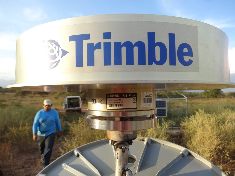 Close up of Chokering antenna with large SCIGN dome that has a large Trimble logo on it.