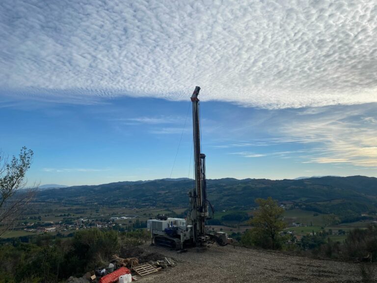 drill rig set up with hills in distance